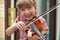 Young Girl At School Learning To Play Violin