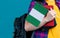 Young girl with school stuff holds in hand Nigeria flag close up
