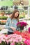 Young girl selecting petunias to purchase