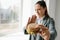 A young girl shows that she does not like a burger. Conceptual image of refusal from unhealthy eating.