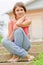 Young girl sits on steps