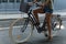 Young girl sitting on her hipster bike in an urban setting