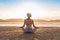Young Girl Sitting Lotus Pose On Beach At Sunset, Beautiful Woman Practicing Yoga Summer Vacation Meditation Seaside