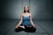 Young girl sitting and meditating