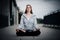 Young girl sitting and meditating