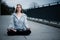 Young girl sitting and meditating