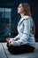 Young girl sitting and meditating