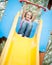 Young girl on slide in playground