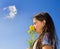 Young girl smelling flowers