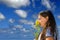 Young girl smelling flowers