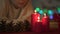 Young girl snuffing out Christmas candles, night before holiday, waiting miracle