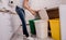 Young girl sorting garbage at the kitchen. Concept of recycling. Zero waste