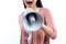 Young girl speaks into megaphone.