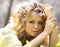 Young girl and spring flowers in her hair