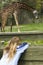 Young girl spying a giraffe