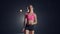 A young girl is standing alone at the track and field stadium and is preparing for the race. Preparation for the sprint