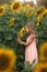 Young girl standing in sunflower field