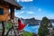 Young girl on steps of house on tree at Atuh beach in Nusa Penida island, Bali in Indonesia.