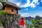 Young girl on steps of house on tree at Atuh beach in Nusa Penida island, Bali in Indonesia.