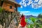 Young girl on steps of house on tree at Atuh beach in Nusa Penida island, Bali in Indonesia.