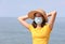 Young girl with straw hat and surgical mask relax comes to the s