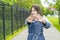 A young girl stretches her hand forward with an open palm as a STOP sign