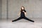 Young girl stretching on studio background.