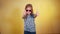 Young girl in sunglasses giving thumbs up. Happy child wearing shades, thumbs up.