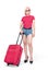 Young girl in sunglasses, shorts and pink t-shirt stands with a suitcase, isolated on white background