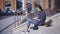 A young girl in sunglasses is working on the stairs outdoors