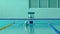 Young girl swimmer, that jumping and diving into indoor sport swimming pool.