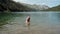 A young girl swims in a mountain lake. Natural nature, Alps.