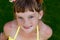 Young girl in a swimsuit on a shelf by the pool