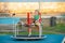 Young girl taking a photograph while sitting on a playground carousel