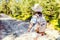 Young girl traveler with backpack while hiking