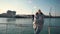 A young girl traveler enjoys a sea view during a sea walk on a ship.