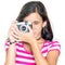 Young girl using a compact camera