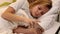 Young girl using smartphone texting in bed