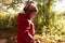 Young Girl Walking In Autumn Woodland