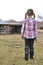 Young girl walking to barn