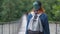 Young girl walks on the suspension bridge