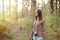 Young girl wandering in the woods