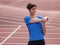 Young girl warming up on the running track