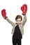 Young girl wearing boxing gloves smiling