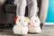 Young girl is wearing cute soft 3d llama slippers