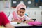 Young girl wearing hijab studying