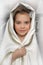 Young girl in a white cape