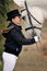 Young girl with white dressage horse