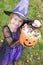 Young girl in witch costume on Halloween