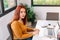 Young girl working at home with a laptop